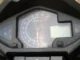 Panel meter Honda MegaPro dengan takometer bertuliskan PGM-FI Fuel Injection dan ikon lampu check engine (MIL) di bawah angka nol